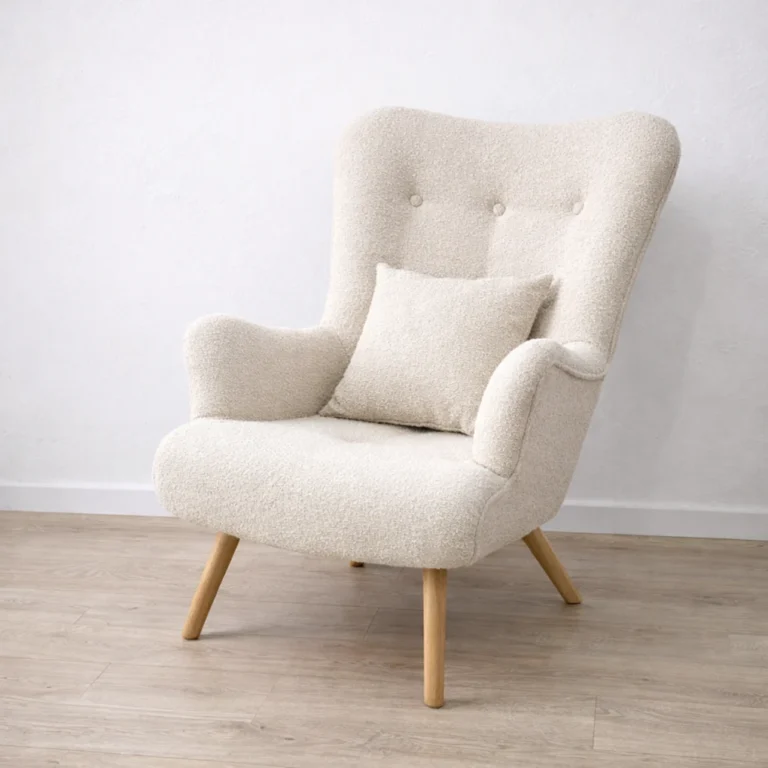 Cream boucle wingback chair in a minimalist interior